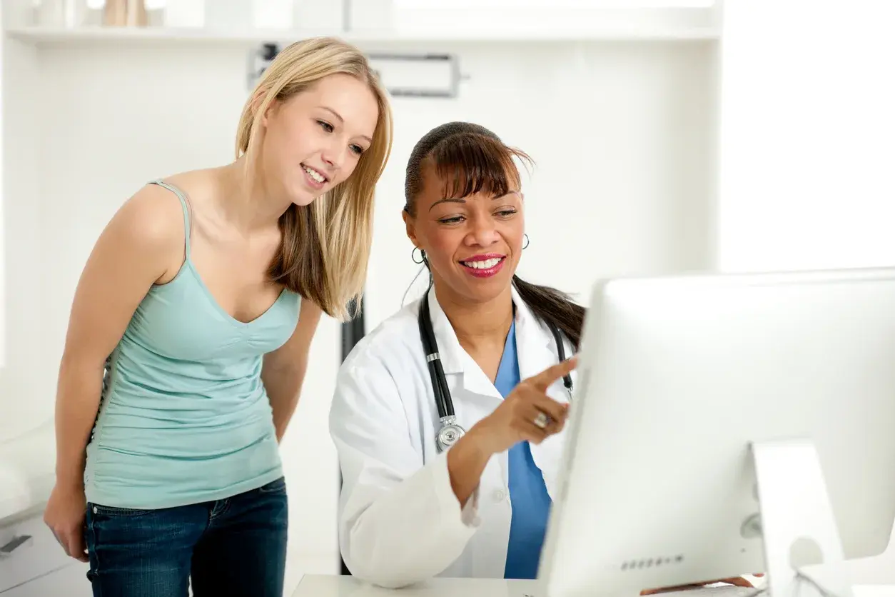 A student having an online GP consultation with a doctor