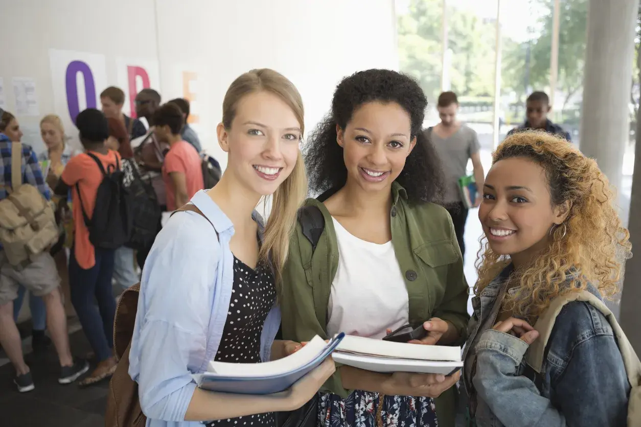 Three students together at college